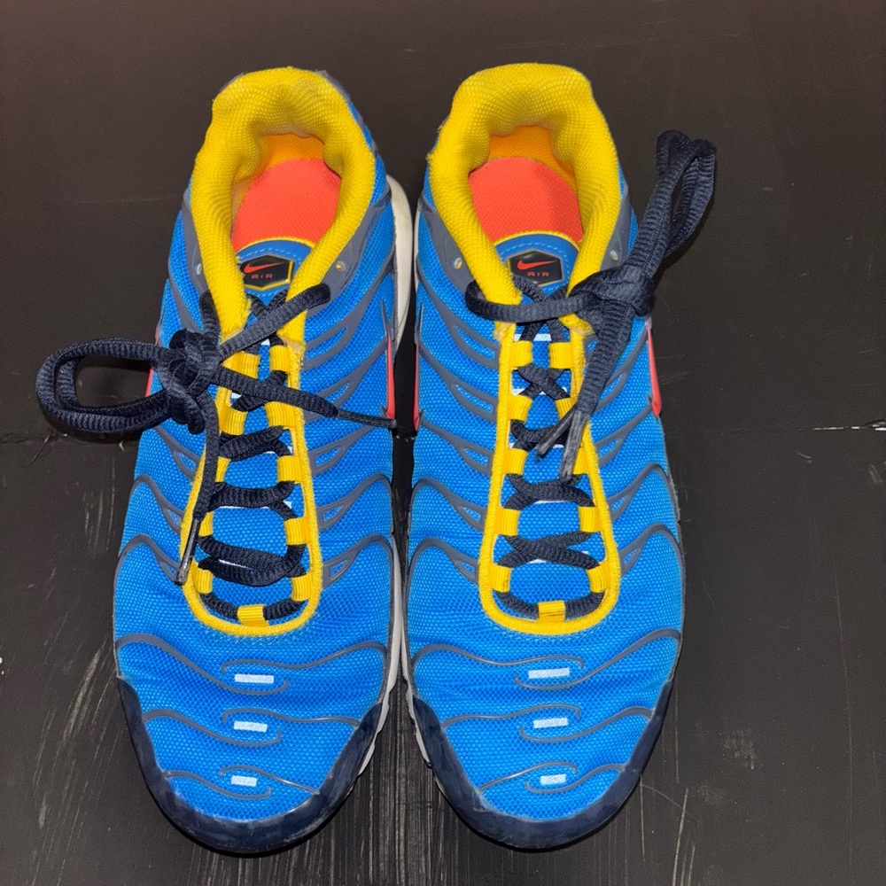 Nike Air Max TN- blue with yellow and red accents.